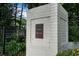 An 'Essex House' sign on a brick pillar, nestled in a beautiful, tree-lined community at 3701 Essex Ave # 2, Atlanta, GA 30339