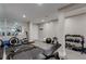 Well-equipped home gym featuring various machines, weights, and mirrored wall for fitness enthusiasts at 3701 Essex Ave # 2, Atlanta, GA 30339
