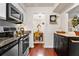 Bright and airy kitchen with stainless steel appliances and a view into the stylish dining room at 3701 Essex Ave # 2, Atlanta, GA 30339