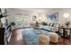 Stylish living room with contemporary decor, hardwood floors, and access to the outdoors through double doors at 3701 Essex Ave # 2, Atlanta, GA 30339