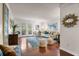 Bright living room featuring hardwood floors, modern decor, and double doors leading to outdoor space at 3701 Essex Ave # 2, Atlanta, GA 30339