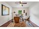 Charming home office with hardwood floors, ceiling fan, wicker chairs and bright light from the window at 3701 Essex Ave # 2, Atlanta, GA 30339