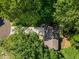 Aerial view of a home surrounded by lush green trees at 4331 Volnay Ne Ct, Marietta, GA 30066
