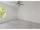 Comfortable carpeted bedroom featuring a ceiling fan and a bright window at 4331 Volnay Ne Ct, Marietta, GA 30066