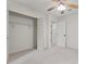This carpeted bedroom features a closet and is fitted with a ceiling fan at 4331 Volnay Ne Ct, Marietta, GA 30066