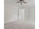 Neutral bedroom features a walk-in closet, carpet, and an overhead fan at 4331 Volnay Ne Ct, Marietta, GA 30066