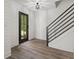 Entryway with black door and modern staircase at 4331 Volnay Ne Ct, Marietta, GA 30066