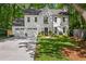 Stunning two-story home with a manicured lawn, attached garage, and classic white painted brick exterior at 4331 Volnay Ne Ct, Marietta, GA 30066