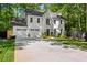 Charming two-story home with a manicured lawn, attached garage, and classic white painted brick exterior at 4331 Volnay Ne Ct, Marietta, GA 30066