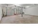 Spacious two-car garage with bright lighting, white walls, and plenty of open space for storage and vehicles at 4331 Volnay Ne Ct, Marietta, GA 30066