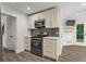 Kitchen featuring stainless steel stove and oven with light wood cabinets at 4331 Volnay Ne Ct, Marietta, GA 30066