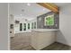 Modern kitchen with island, wood beam and stylish tile backsplash at 4331 Volnay Ne Ct, Marietta, GA 30066
