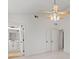 Spacious bedroom with a ceiling fan, double doors, and en-suite bathroom for modern comfort at 4331 Volnay Ne Ct, Marietta, GA 30066