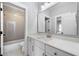 Bright, stylish bathroom featuring white cabinets, quartz countertop, and decorative floor tile at 1010 Fendley St, Woodstock, GA 30188