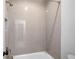Bathroom shower stall with grey subway tile and bronze shower head and faucet at 1010 Fendley St, Woodstock, GA 30188