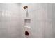 Modern tiled shower with bronze fixtures and built-in shower niche at 1010 Fendley St, Woodstock, GA 30188