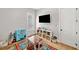 Spacious bedroom featuring modern decor and bright lighting at 1010 Fendley St, Woodstock, GA 30188