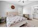 Bright bedroom showcasing a lovely mirror-finished side table and ensuite bathroom at 1010 Fendley St, Woodstock, GA 30188