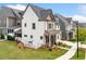 Side view of a well-manicured lawn and stylish siding accents at 1010 Fendley St, Woodstock, GA 30188