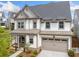 Attractive home with a large front-facing garage and inviting curb appeal at 1010 Fendley St, Woodstock, GA 30188