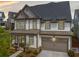 Beautiful home showcasing a well-maintained exterior with a two-car garage at 1010 Fendley St, Woodstock, GA 30188