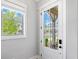 An inside view of the front door showcasing the light coming in from the porch at 1010 Fendley St, Woodstock, GA 30188