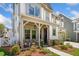 Inviting front porch with cozy seating and decorative stone accents at 1010 Fendley St, Woodstock, GA 30188