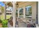 Cozy front porch featuring stone accents, comfortable seating, and a stylish hanging lantern at 1010 Fendley St, Woodstock, GA 30188