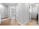 Bright hallway with hardwood floors and views of bedrooms at 1010 Fendley St, Woodstock, GA 30188