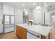 Kitchen island with stone countertops and stainless steel appliances at 1010 Fendley St, Woodstock, GA 30188