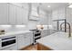 Contemporary kitchen with white cabinetry, stainless steel appliances, and a center island at 1010 Fendley St, Woodstock, GA 30188