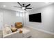 Comfortable living room with cozy sofa and an entertainment center with large screen television at 1010 Fendley St, Woodstock, GA 30188