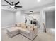 Comfortable living room with soft couch, large entertainment center, and recessed lighting at 1010 Fendley St, Woodstock, GA 30188