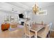 Bright open floorplan features a living room, dining area, and a view of the backyard at 1010 Fendley St, Woodstock, GA 30188