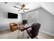 Home office features plenty of natural light and a nice desk and office chair at 1010 Fendley St, Woodstock, GA 30188