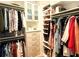 Organized walk-in closet featuring custom shelving and drawers for optimal storage at 1010 Fendley St, Woodstock, GA 30188