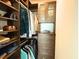 Walk-in closet featuring custom shelving and drawers for optimal storage at 1010 Fendley St, Woodstock, GA 30188