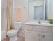 Bright bathroom featuring a vanity with storage and a shower with a colorful curtain at 2595 Grapevine Cir, Cumming, GA 30041