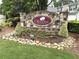 Stone community sign: The Orchards of Habersham Grove, with manicured landscaping at 2595 Grapevine Cir, Cumming, GA 30041