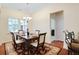 Well-lit dining room with a chandelier, perfect for enjoying meals with Gathering and friends at 2595 Grapevine Cir, Cumming, GA 30041