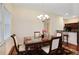 Bright dining room with chandelier and access to the kitchen, perfect for entertaining at 2595 Grapevine Cir, Cumming, GA 30041