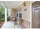 Cozy front porch featuring comfortable seating, brick accents, and a welcoming entrance at 2595 Grapevine Cir, Cumming, GA 30041
