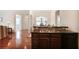 Partial kitchen view showcasing countertops, cabinets, and seamless access to the living space at 2595 Grapevine Cir, Cumming, GA 30041