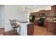 Modern kitchen with stainless steel appliances, granite countertops, and a convenient breakfast bar at 2595 Grapevine Cir, Cumming, GA 30041