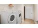 Bright laundry room with modern washer and dryer at 2595 Grapevine Cir, Cumming, GA 30041