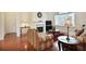 Spacious living room with a fireplace, large windows and hardwood floors, creating a cozy atmosphere at 2595 Grapevine Cir, Cumming, GA 30041