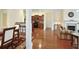 Open-concept living area with hardwood floors, view to kitchen, and dining space at 2595 Grapevine Cir, Cumming, GA 30041