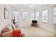 Bright living room with neutral decor, multiple windows, and a comfortable sofa at 2595 Grapevine Cir, Cumming, GA 30041