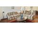Comfortable living room with two sofas, a patterned rug, and natural light at 2595 Grapevine Cir, Cumming, GA 30041
