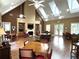 Bright living room with fireplace, built-in bookshelves, and multiple seating areas at 2595 Grapevine Cir, Cumming, GA 30041